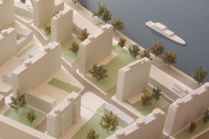 an architectural model, showing tower blocks interspersed with parks and trees.